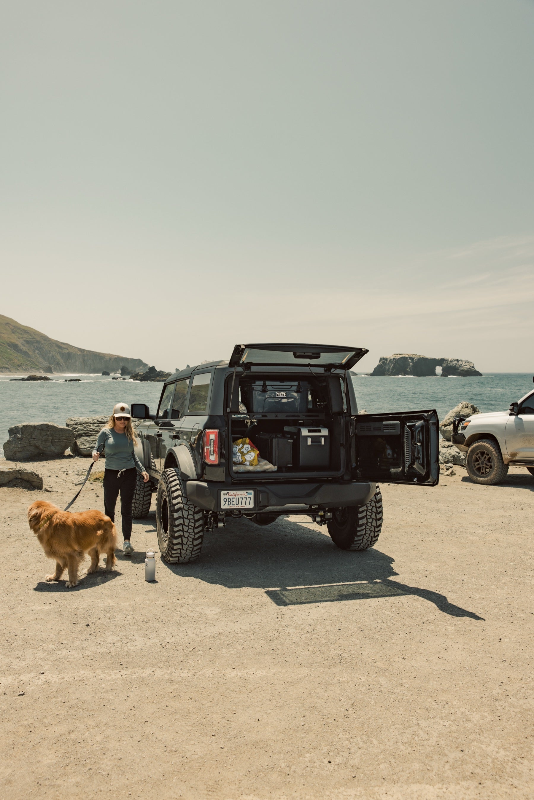 Ford Bronco at the coast with Platform A loaded in the cargo area