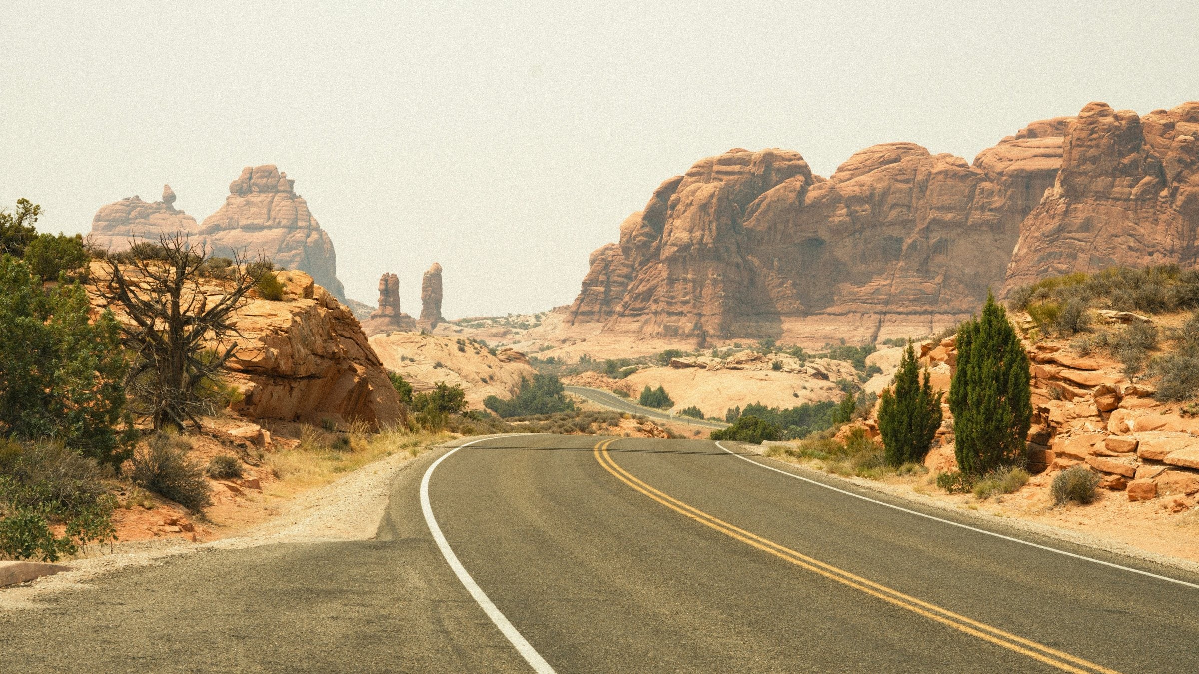 Open road into the red rock outside Moab