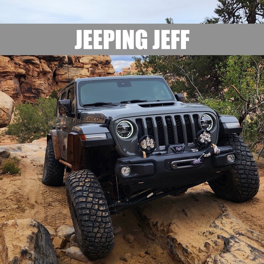 Jeeping Jeff with their vehicle